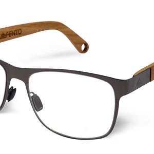 May include: A pair of dark gray metal eyeglasses with clear lenses and wooden brown temples. The brand name "AFENTO" is printed on the temple.
