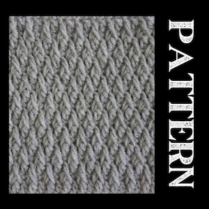May include: A close-up of a grey crocheted fabric with a diagonal stitch pattern.