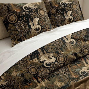 May include: A bedding set featuring a black background with a repeating pattern of white dragons, stone castles, compass roses, crescent moons, and forest trees. The design includes small deer and floral elements, creating a detailed, dark-toned textile.