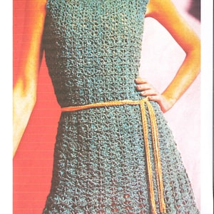 May include: A teal crochet dress with a yellow crocheted belt. The dress has a square neckline and a flared skirt.
