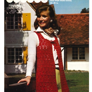 May include: A red crochet vest with a tie closure. The vest is long and has a lacy pattern. The model is wearing a white shirt and green pants. The image is from a vintage crochet pattern book.