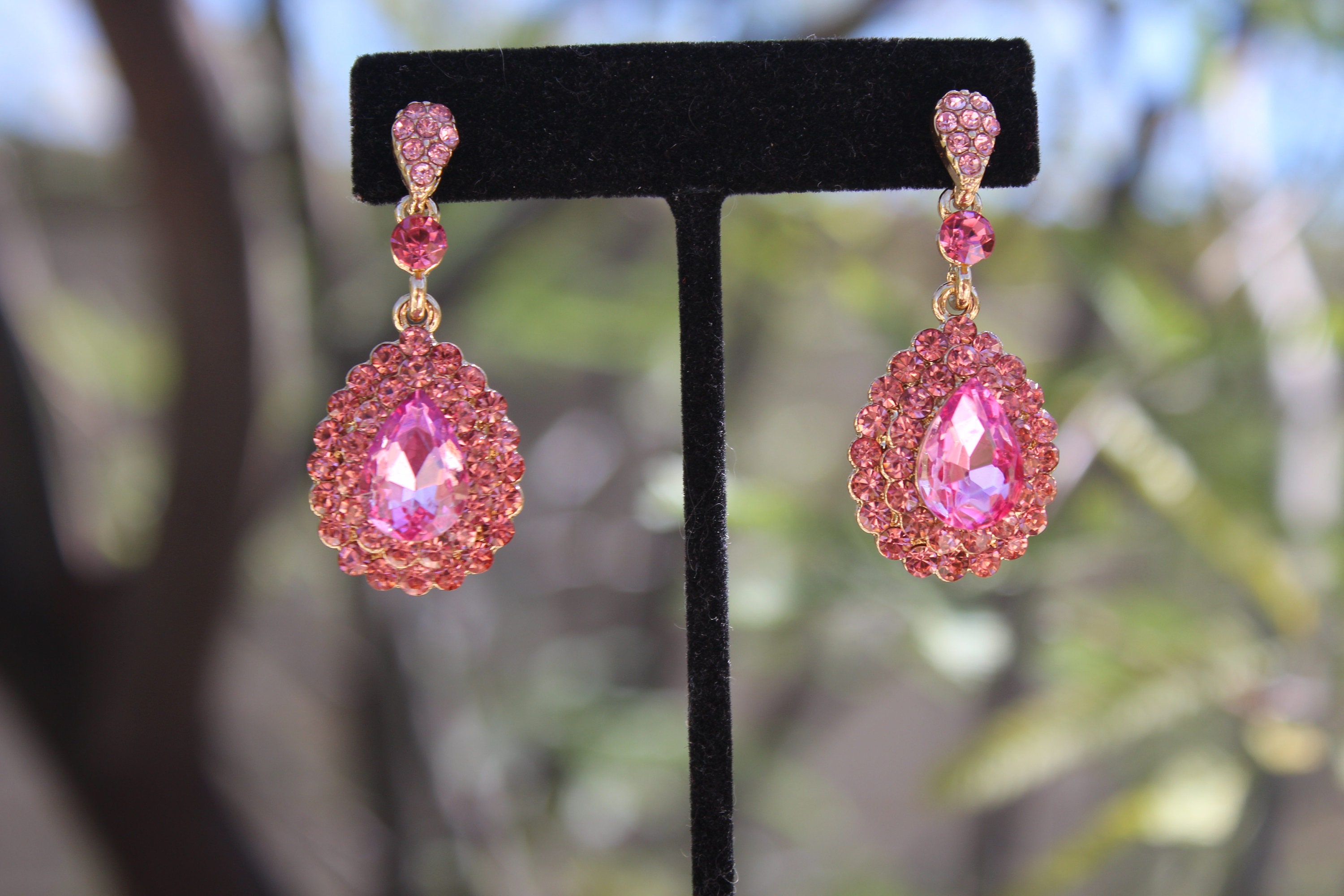 Gold earrings with dark pink stones | JewelryAndGems.eu