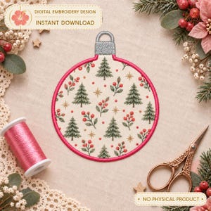 May include: A circular digital embroidery design featuring a cream-colored background with a repeating pattern of green pine trees, red berries, and gold stars, finished with a bright pink stitched border and a silver hanging loop at the top.