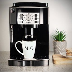 Custom coffee mug on a coffee machine.