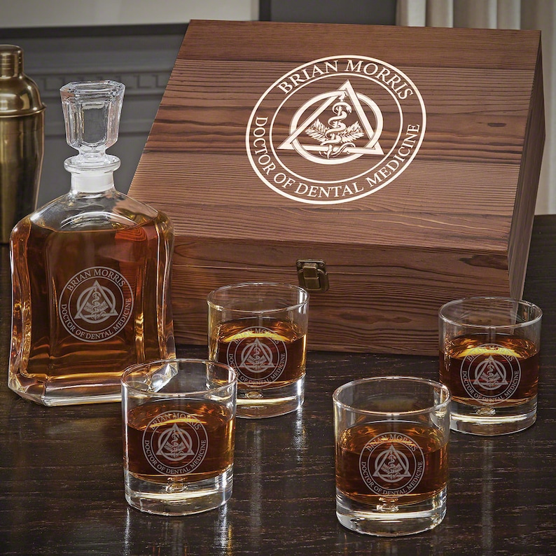 Engraved whiskey set with four personalized rocks glasses and wooden box.