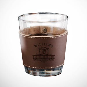 May include: A brown leather wrapped glass with the text "Williams Established 2025" and a monogrammed "W" in a circle.