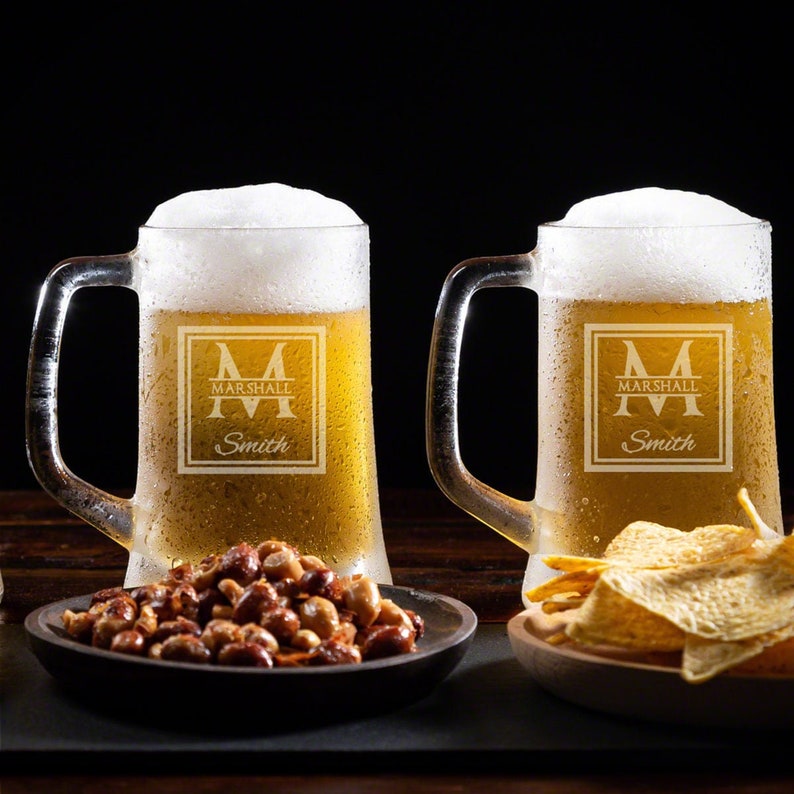 Two etched beer glasses.