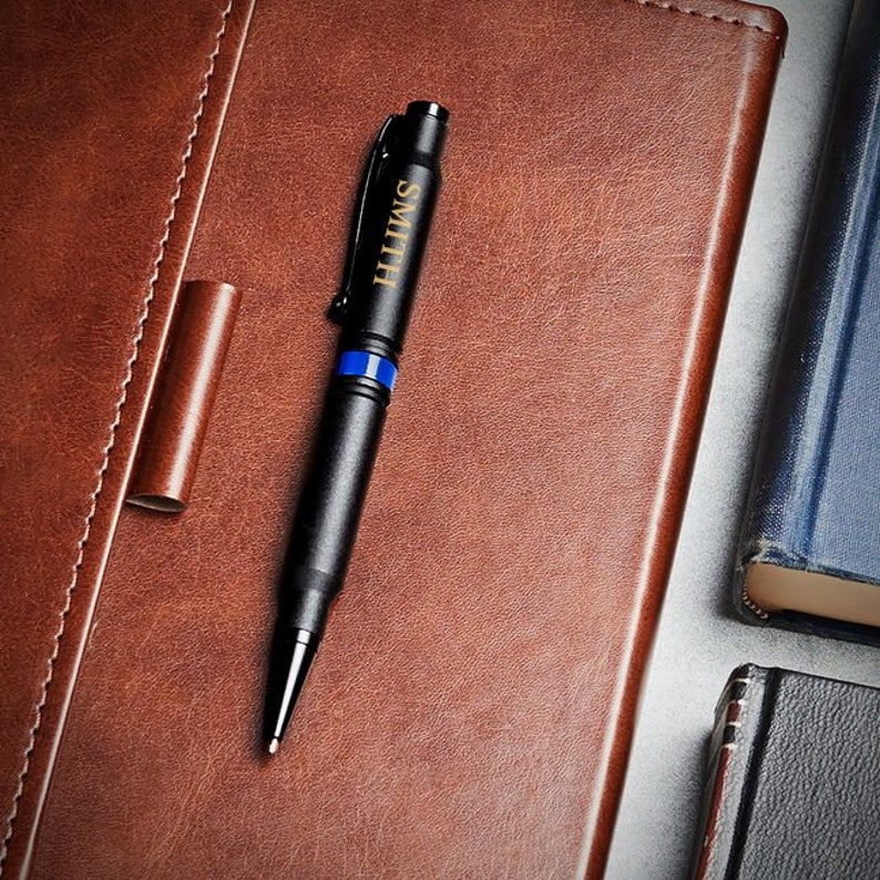 Personalized .308 Bullet Pen with Thin Blue Line detail, engraved with a name.