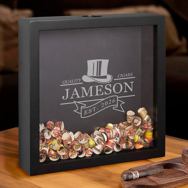 Personalized cigar shadow box with cigar bands inside.
