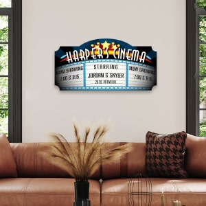 A personalized home theater sign made from birch wood with vivid colors and a natural wood grain finish.