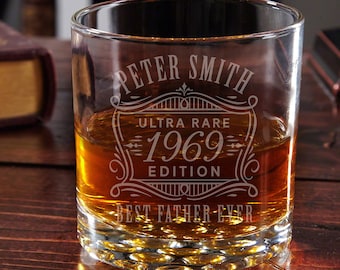 May include: A clear glass tumbler with a vintage-style design etched on the side. The design features the text "Peter Smith Ultra Rare 1969 Edition Best Father Ever".