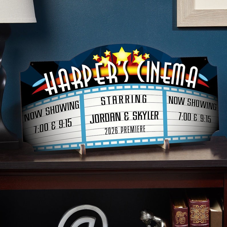 Close-up of home theater sign with title and three phrases.