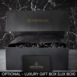 Black luxury gift box with paper raffia fillings.