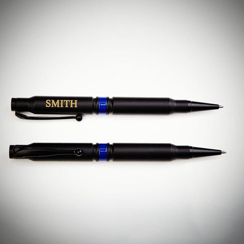 Two custom .308 Bullet Pens with Thin Blue Line design with engraved name on one pen.