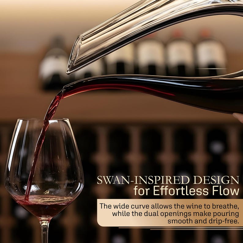 May include: A clear glass wine decanter pouring red wine into a wine glass. The decanter has a swan-inspired design. Text on the image reads: "SWAN-INSPIRED DESIGN for Effortless Flow". The text also mentions the wide curve allows the wine to breathe.