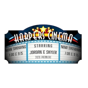 May include: A red, white, and blue movie marquee sign with the text "HARPERS CINEMA" in a yellow and black font. The sign has a blue and white film strip border with the text "NOW SHOWING 7:00 & 9:15" on the left and right sides. The center of the sign has the text "STARRING JORDAN & SKYLER 2020 PREMIERE".
