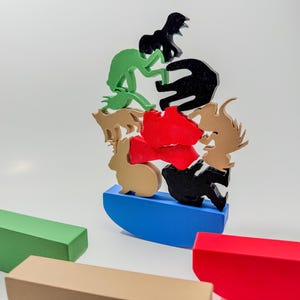 May include: A colorful wooden stacking toy featuring a variety of animal shapes, including a frog, a bear, a rabbit, and a deer. The animals are stacked on top of a blue base.