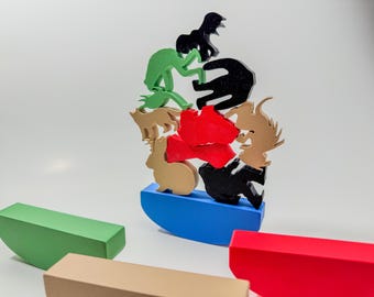 Juego de apilamiento de críptidos colapsantes: Hombre polilla, Monstruo de Flatwoods, Nessie, Hombre rana de Loveland
