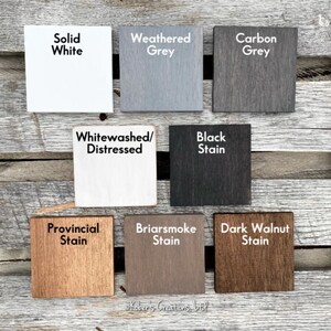 May include: Nine wood samples stained in different colors, including solid white, weathered grey, carbon grey, whitewashed/distressed, black stain, provincial stain, briarsmoke stain, and dark walnut stain.