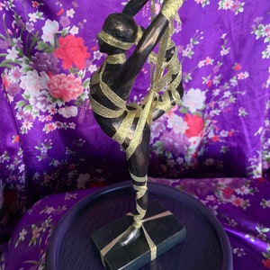 Abstract female dancer ribbon tied bondage figure