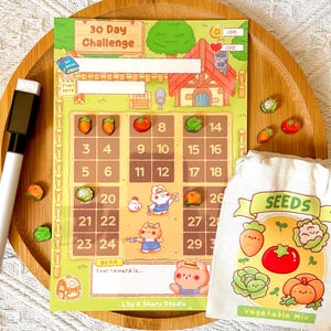 May include: A 30 Day Challenge garden-themed tracker sheet with numbered squares, a white dry-erase marker, a small beige drawstring bag labeled SEEDS with vegetable illustrations, and several small vegetable-shaped magnetic tokens.