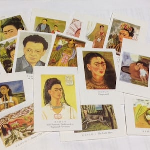 May include: A collection of rectangular art cards featuring various paintings by Frida Kahlo. Each card displays a different artwork, including self-portraits and still lifes, with the artist's name and the title of the piece printed in black text at the bottom.