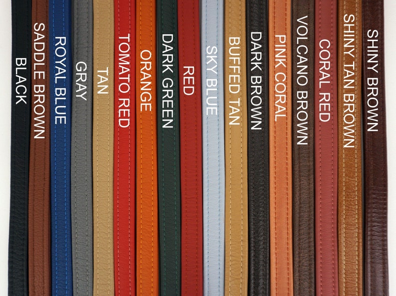 May include: A selection of leather straps in various colors, including black, saddle brown, royal blue, gray, tan, tomato red, orange, dark green, red, sky blue, buffed tan, dark brown, pink coral, volcano brown, coral red, shiny tan brown, and shiny brown.