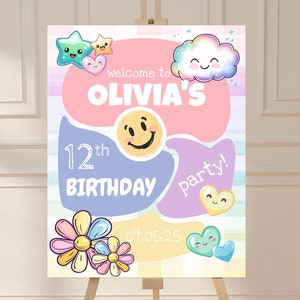 May include: A colourful birthday party sign with a rainbow background and a pink, purple, and blue design. The sign says "Welcome to Olivia's 12th Birthday Party!" with a smiley face, a cloud, and flowers.