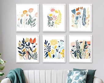 May include: A set of six framed prints featuring abstract floral designs in a modern style. The prints are in a white frame and feature a variety of colours, including blue, yellow, orange, and green.