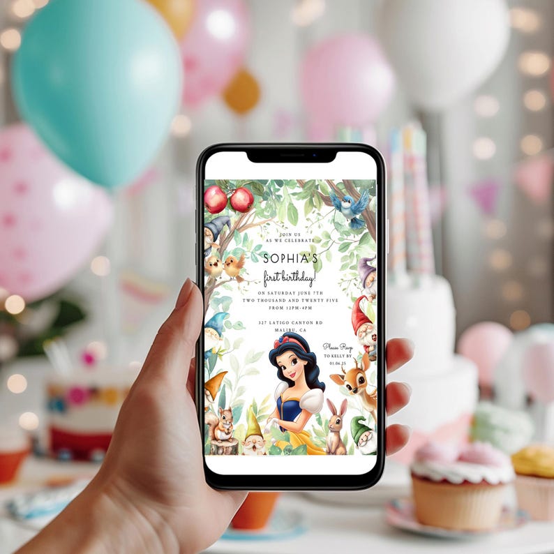 May include: A smartphone displays a colorful invitation for Sophia's first birthday. The design features Snow White, woodland creatures, and the text "Sophia's first birthday." The background includes balloons and a cake.