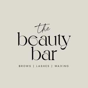 May include: The Beauty Bar logo with the text "the beauty bar" in a stylised font. The text "brows | lashes | waxing" is below the logo.