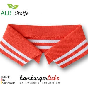 Könnte beinhalten: Orangefarbener Strickkragen mit weißen Streifen. Der Kragen ist für Nähprojekte und hat eine gerippte Struktur. Der Text "ALB Stoffe" und "hamburgerliebe by SUSANNE FIRMENICH" ist sichtbar.