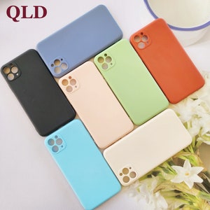 May include: A set of 7 phone cases in various colors, including black, blue, green, beige, light blue, and orange. The cases are made of silicone and have a raised camera bump.