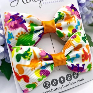 Dinosaur bows, Dino bow, dinosaur hair bow, bright hair bows, pair of clips, orange dinosaur bow, green dinosaur, girls love dinosaurs too