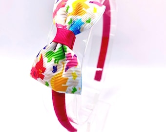 Dinosaur head band, dinosaur hair band, pink Alice band, dinosaur hair bow, thin head band with bow