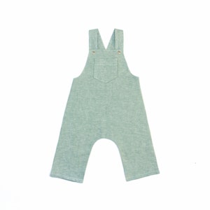 May include: A light green pair of overalls with a single pocket on the front.