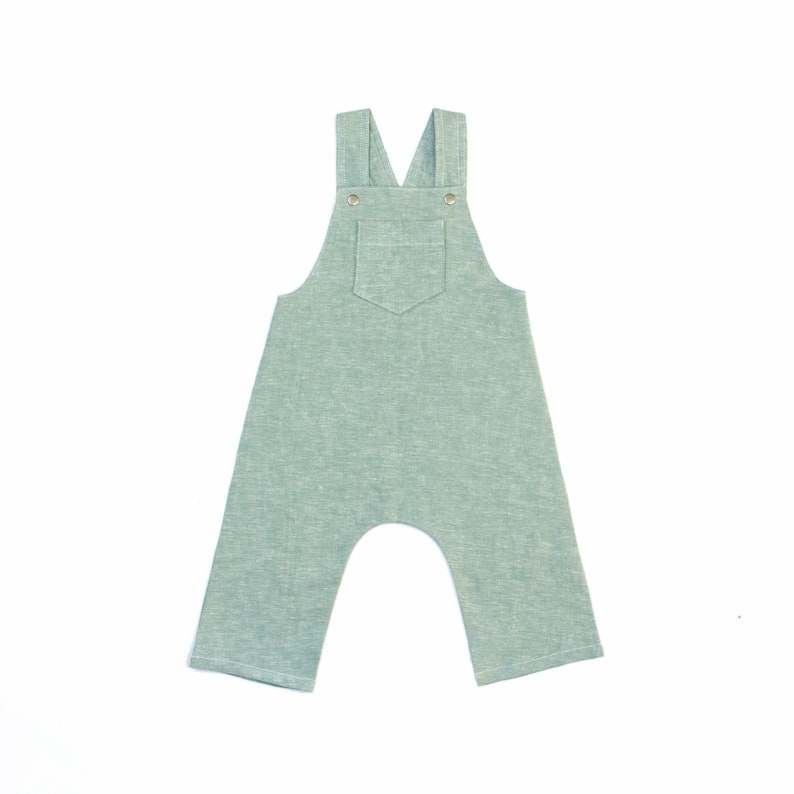 May include: A light green pair of overalls with a single pocket on the front.