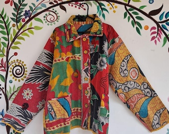 May include: A colorful patchwork jacket with a button-up front and long sleeves. The jacket is made of a variety of fabrics and has a unique, bohemian style. The text "size-2XL" is printed on the bottom of the image.
