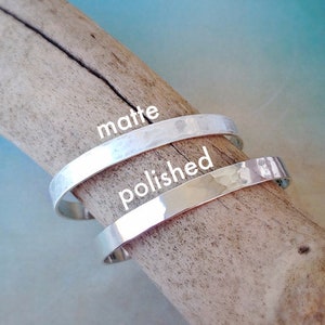 Outside finish can be polished or matte. Polished looks shiny and mirrored, while matte looks flat and lighter in color. Bracelets are lightly hammered for a handmade or artisan look.
