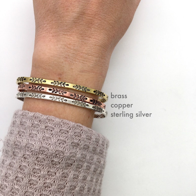 Each of our metal options: brass, copper, and sterling silver, shown on model. These stack great together or with other bracelets, or look minimal and dainty worn alone. They are comfortable to wear.