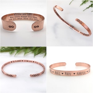 May include: Four copper-colored cuff bracelets. One has the text "Good Friends Are Like Stars, You Don't Always See Them, But You Know They Are There" and infinity symbols. Another has the text "long after she lets go" and an infinity symbol. The third has names and hearts.