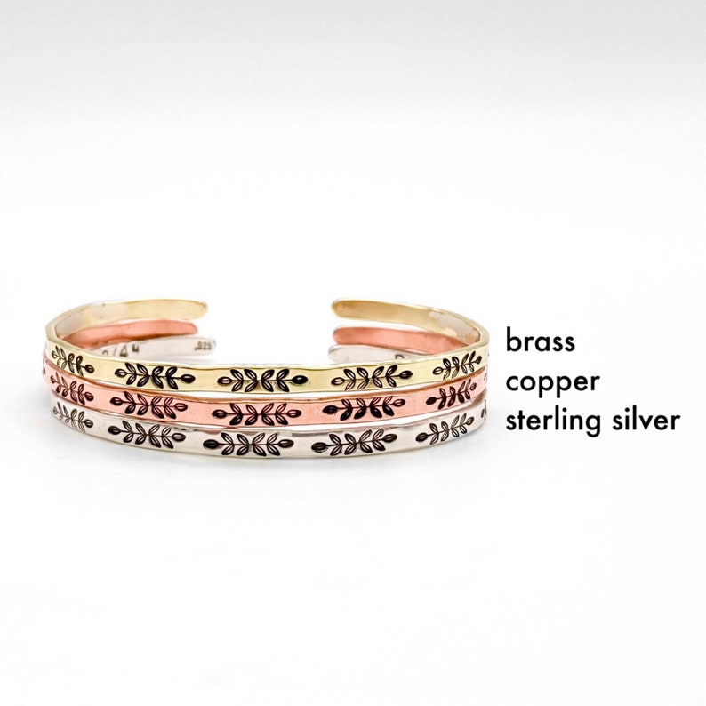 Thin stacking cuff bracelet can be made in gold toned brass, rose toned copper, or sterling silver. Darkened leaf design on front contrasts well on all metal choices.