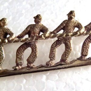 Art Deco Silver Tug-Of-War Brooch / Pendant