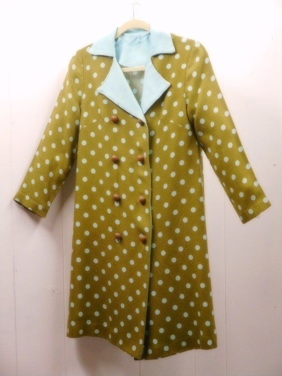 A polka dot dress coat giving a double breasted ap
