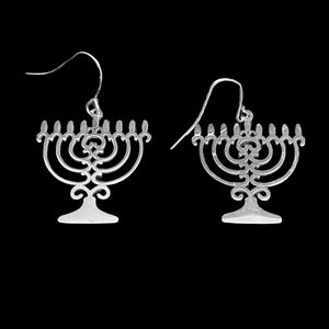 May include: A pair of silver menorah earrings. The earrings are in the shape of a menorah with seven candles. The menorah is a traditional Jewish symbol.