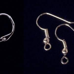 May include: A close-up of different earring styles, including earring posts, leverbacks, fishhook ear wires, and clip-ons.