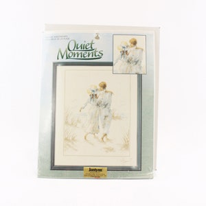 May include: A cross-stitch pattern featuring a couple walking on a beach. The pattern is titled "Quiet Moments" and is by Janlynn.