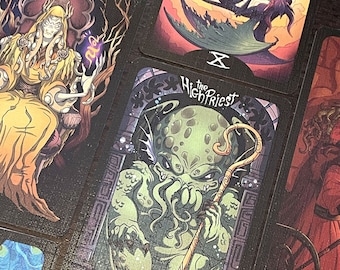 May include: Tarot card depicting "The High Priestess" with a green, tentacled creature holding a staff. The card has a dark background with gold accents and the text "The High Priestess" in a gold font.