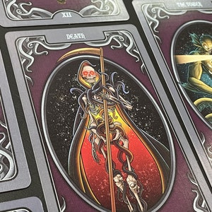 May include: Tarot card depicting Death, the 13th card in the Major Arcana. The card features a skeletal figure in a red and black robe, holding a scythe and surrounded by a swirling mass of tentacles.