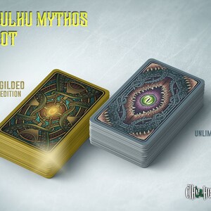 May include: Two decks of Cthulhu Mythos Tarot cards. The deck on the left is a gilded limited edition with gold edges. The deck on the right is an unlimited edition with silver edges. Both decks feature a detailed illustration of a tentacled creature with an eye on the back of the cards.